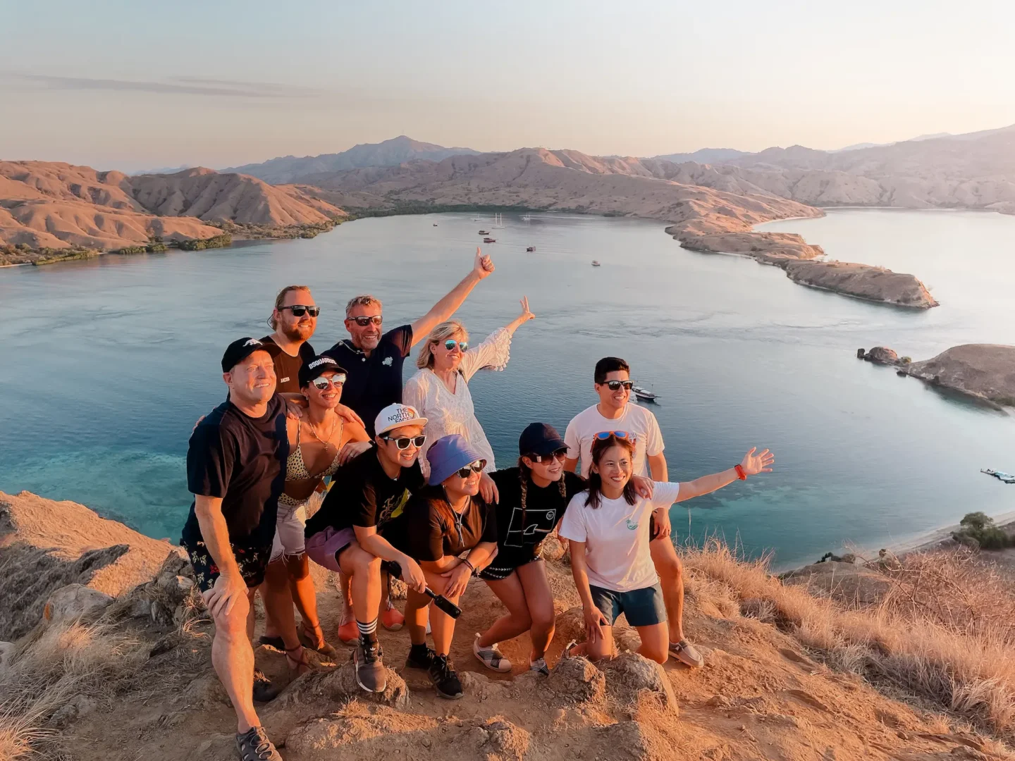 A group of customers taking picture on top of Gili Lawa